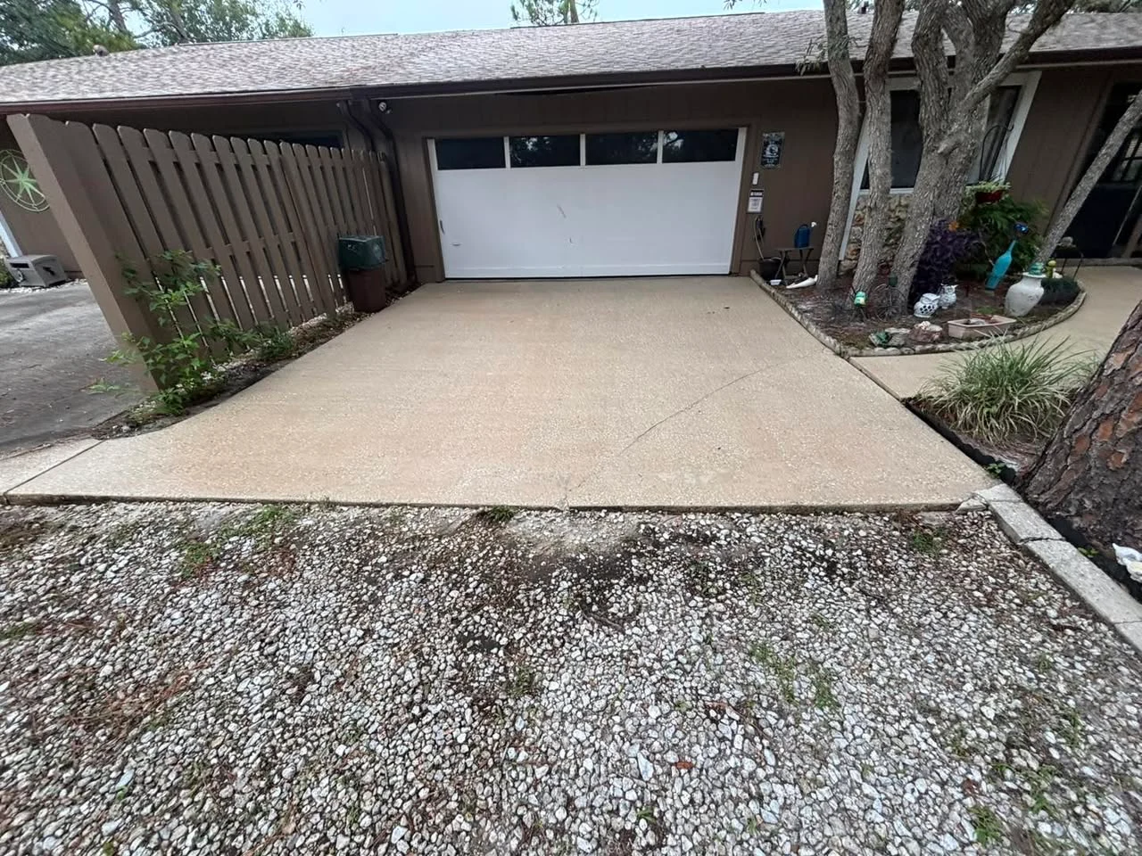 Clean concrete in front of a garage